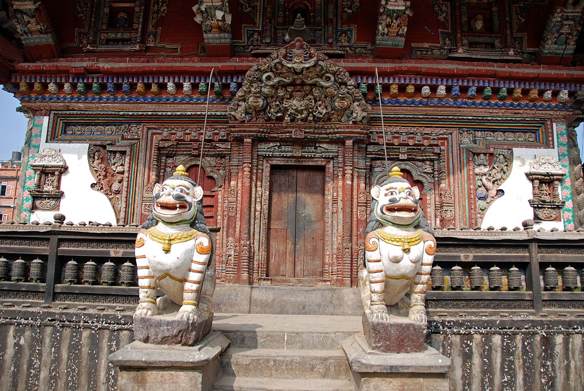 Kathmandu Patan 02-1 Rato Red Machhendranath Temple One Of The Carved Doorways Guarded By Two Lions 